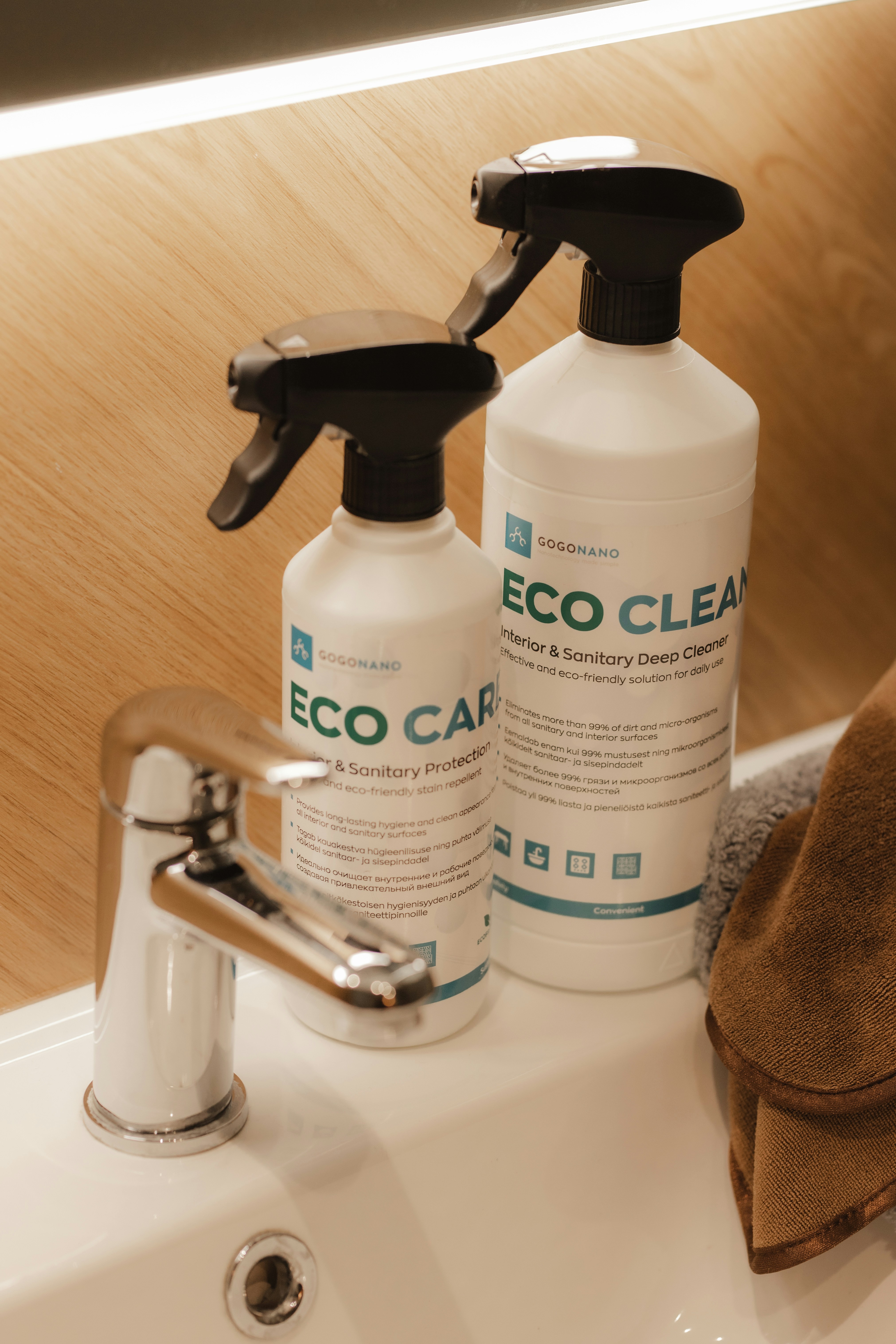 Eco-friendly cleaning products on a wooden shelf