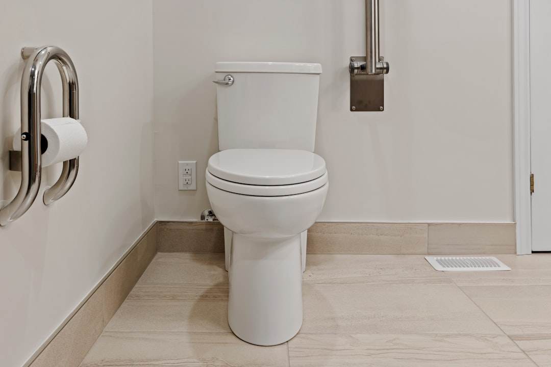 Clean white bathroom toilet in Singapore home showing good hygiene.